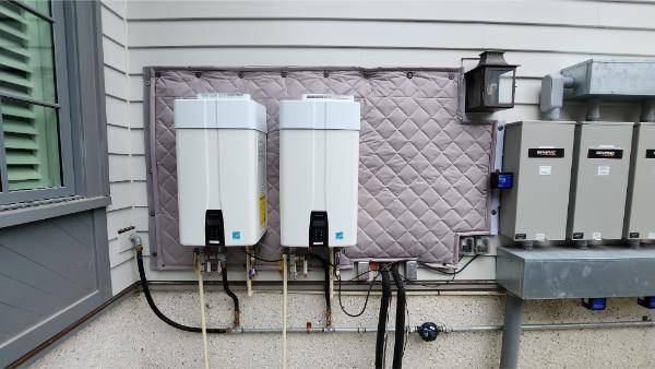 generator box mounted to wall with acoustic blanket