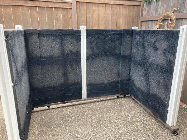 white vinyl fence with blocknzorbe on it
