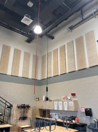 wood wool installed high on shop class walls