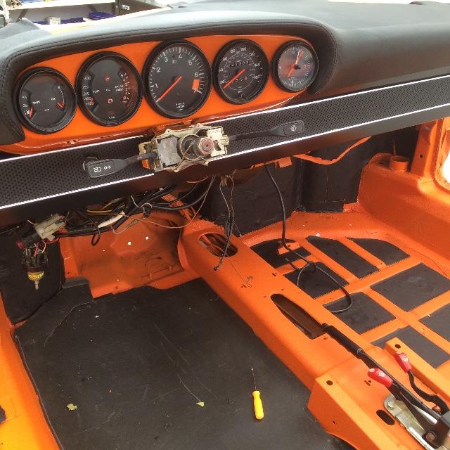 Damplifier Pro sound deadening installed on floor and firewall of orange Porsche Carrera during restoration