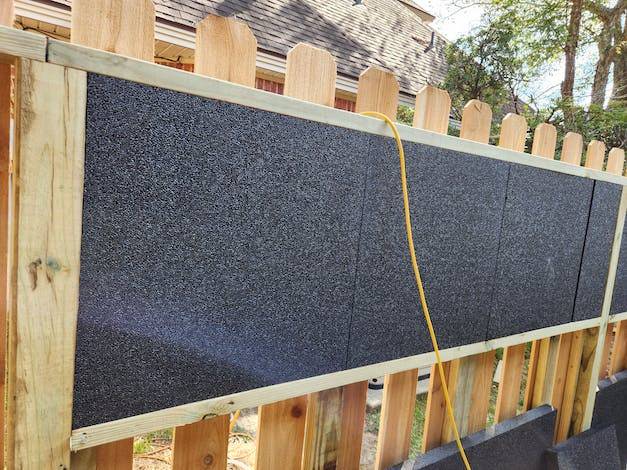 blocknzorbe installed between wood fence panels