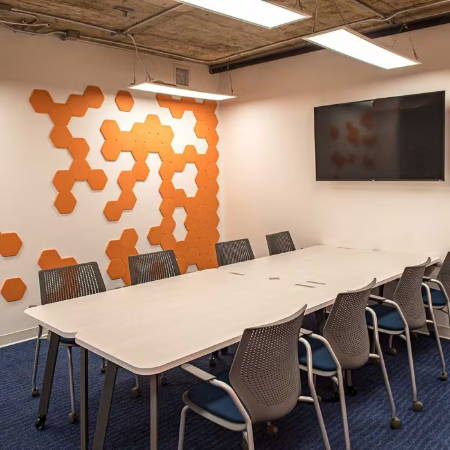 orange hexagons on conference room wall