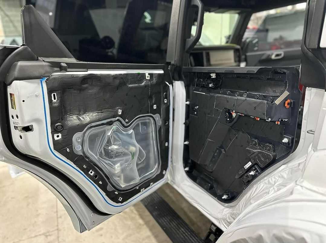 Ford Bronco door panel with butyl sound deadening mat applied to the inner skin