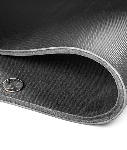 Luxury Liner Pro rolled back to show thickness, with coin for scale
