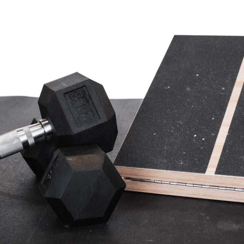 weights and slant board on stomp roll rubber flooring