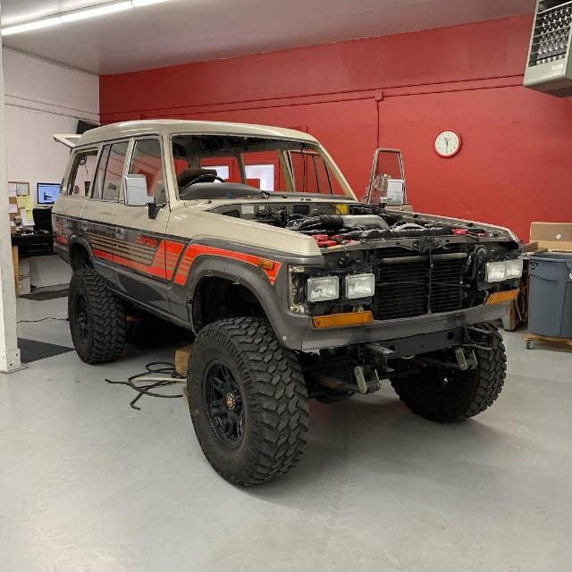1986 Toyota Land Cruiser FJ60 with hood open, treated with Damplifier Pro, Mega Zorbe, and Luxury Liner Pro