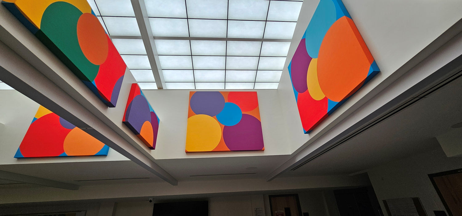 Custom print fabric wrapped acoustic panels installed on upper walls at Kips Bay Boys and Girls Club