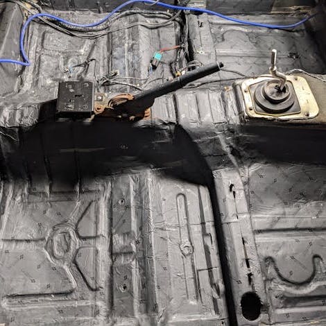 Damplifier covering floor of vehicle