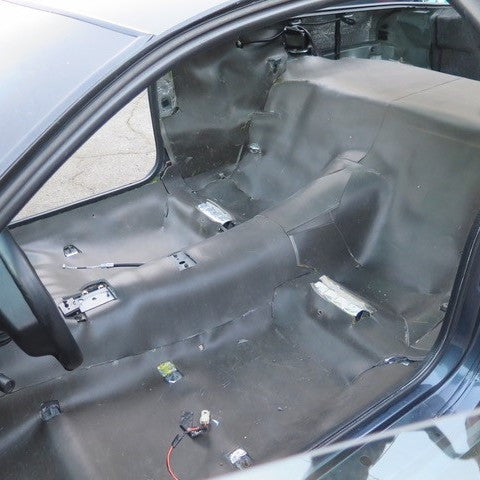 Covering floor and back wall with Luxury Liner Pro automotive sound barrier