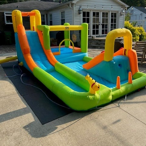 stomp mat used outside under an inflatable bounce house