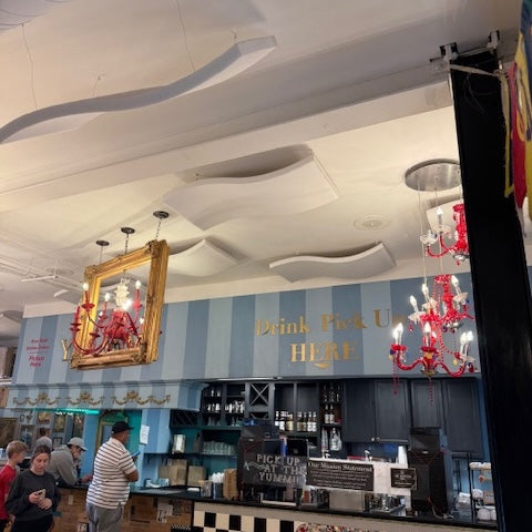 Mela Mute Wave Cloud hanging in a coffee shop