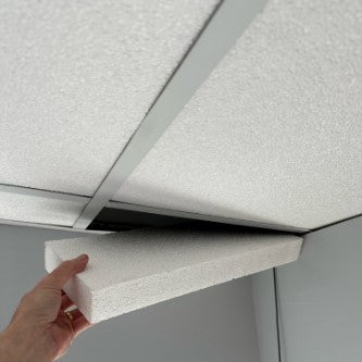 blocknzorbe ceiling tiles (white) being installed in a drop ceiling grid