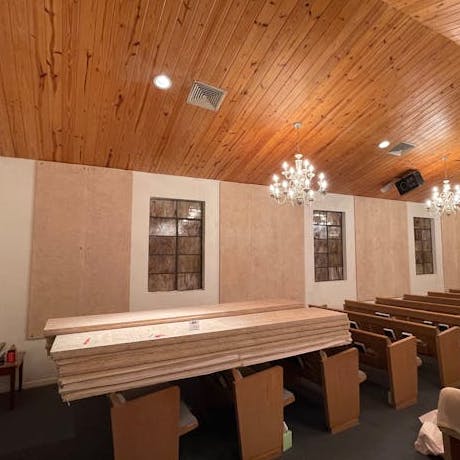 Timberwool wood wool acoustic panels installed on walls of church (primed clear)