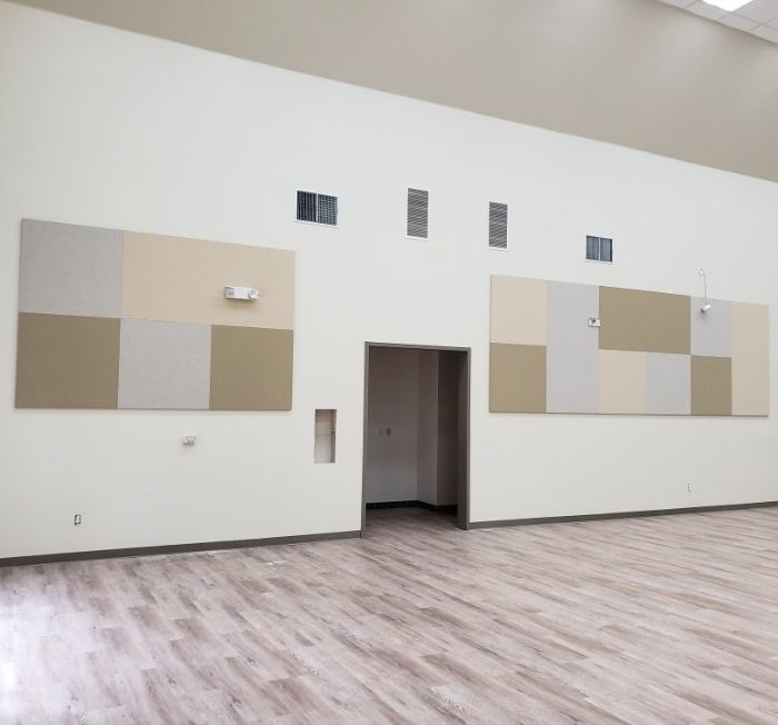 open multi-use room with acoustic panels on the walls
