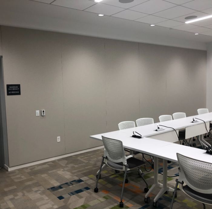 large fabric wrapped panels on wall in a conference room
