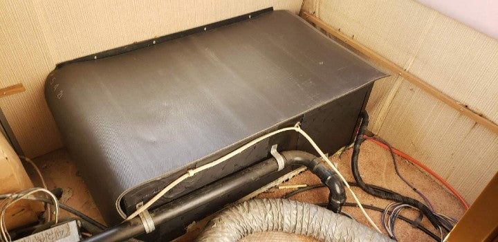 Luxury Liner Pro MLV barrier wrapped around RV generator compartment for soundproofing