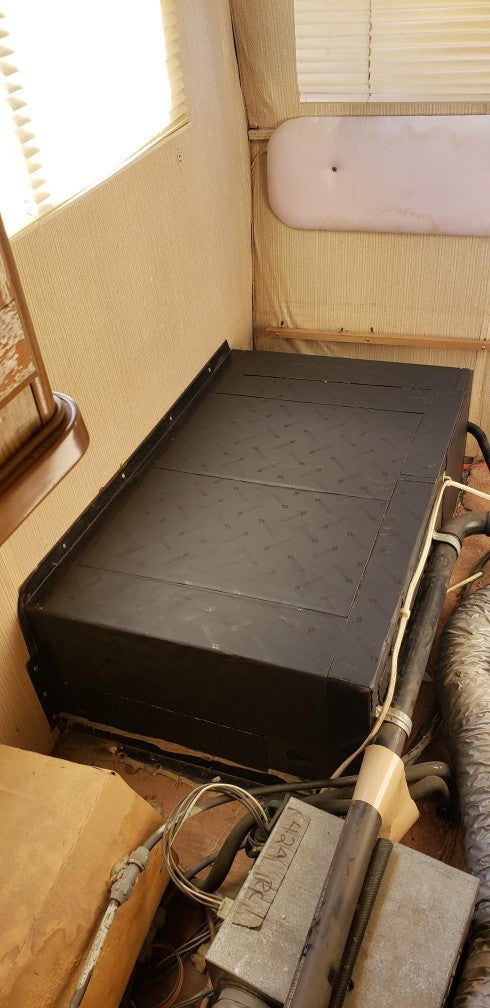 Damplifier Pro sound deadening mat installed over RV generator inside cabin