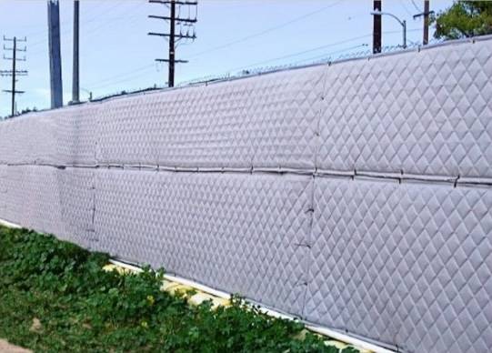 soundproof blankets on chain link fence (horizontal)