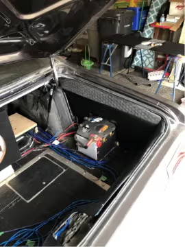 Plymouth Duster trunk with uncovered battery