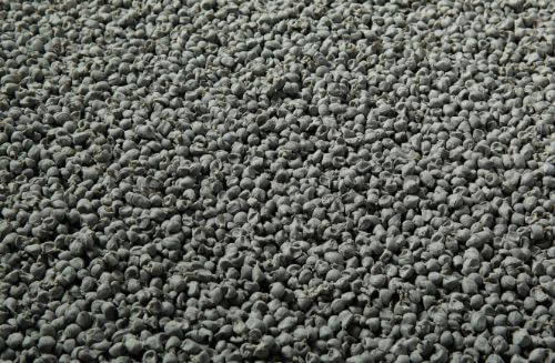 Close-up texture of grey granular Spectrum Sludge liquid sound deadener material