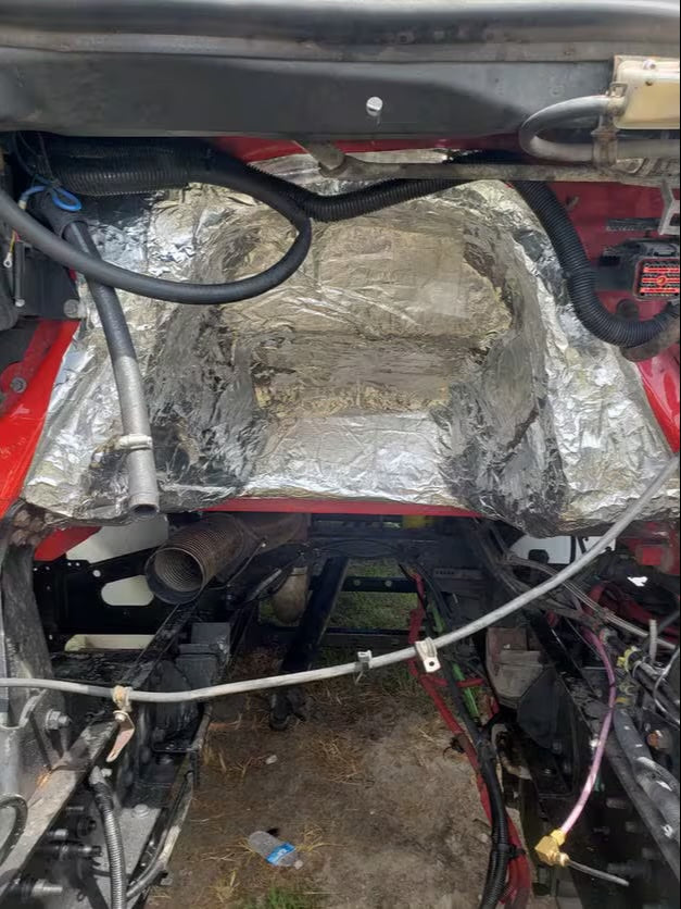 Heat Wave Pro thermal insulation applied to vehicle firewall, silver foil face visible under open hood