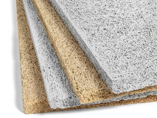 Timberwool wood wool acoustic panels in natural and white finishes, stacked to show texture and thickness
